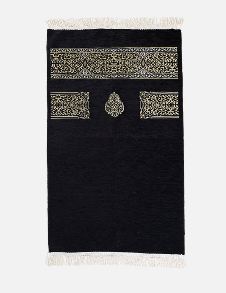 Kiswah Musallah in black, prayer mat with Kaabah-inspired geometric patterning in the Kiswah's own colour