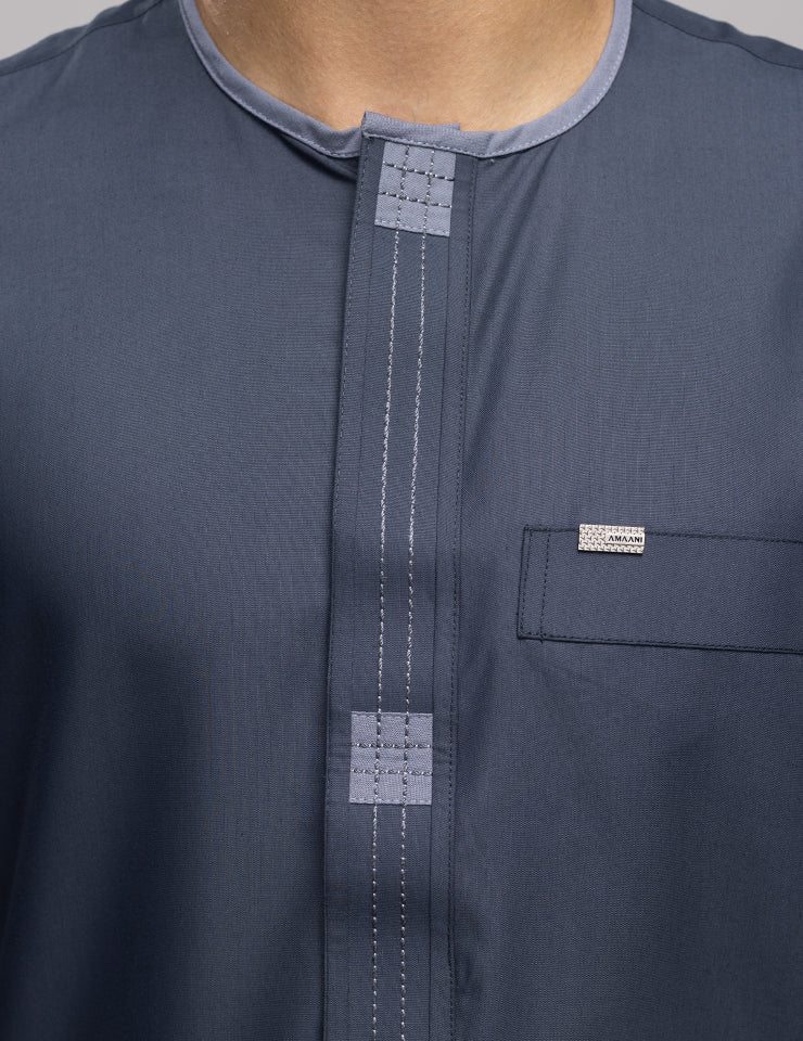 Soft grey Amaani Dune Thobe showing minimalist collarless design, premium men's thobe South Africa
