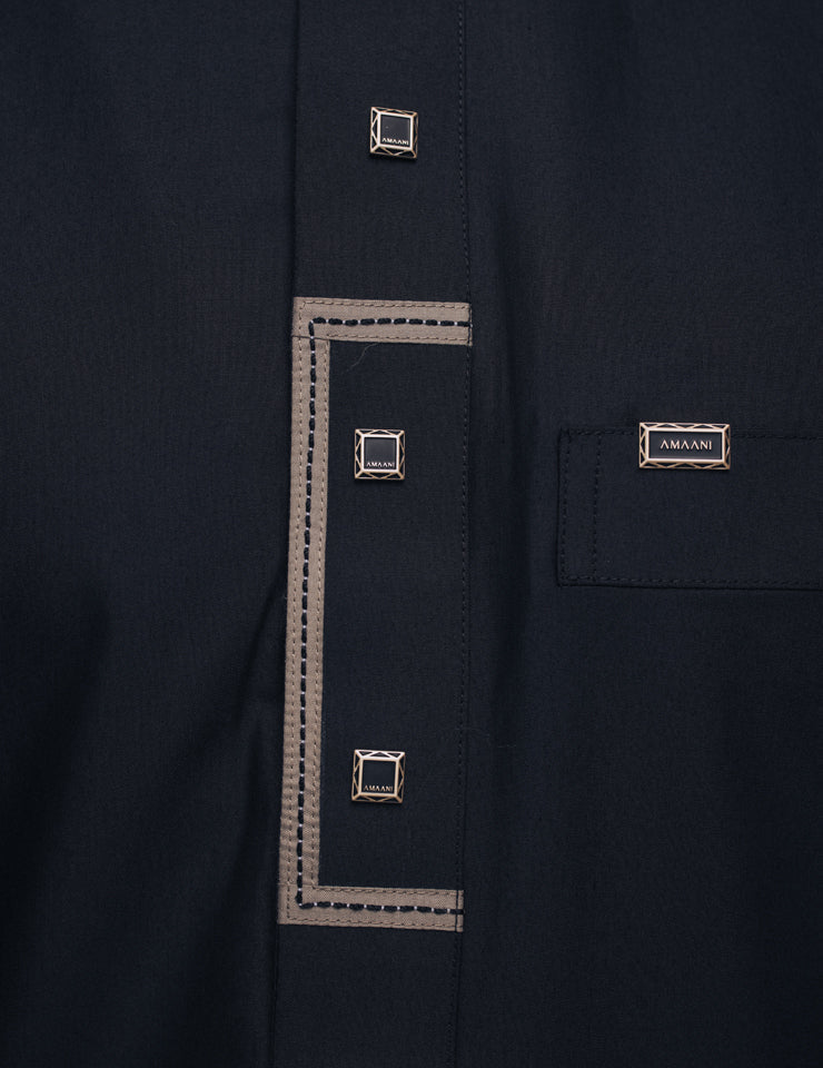 Detail of the black Elegance thobe by Amaani, patterned cuffs with signature buttons