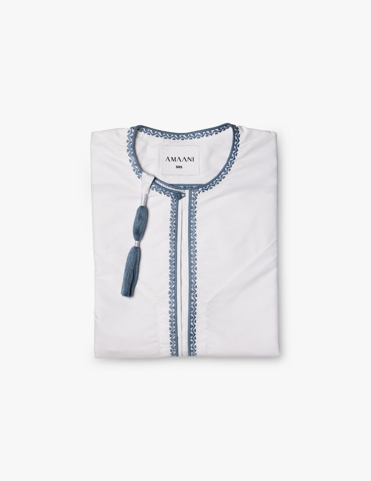 Amaani Topaz Omani thobe in crisp white with cerulean blue contrast placket and collar tassel