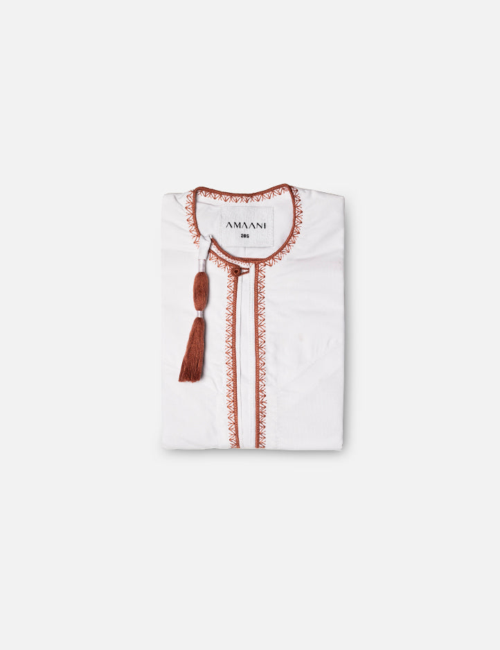 Amaani Desert Coral Omani Kids thobe, crisp white with coral contrast placket and cuffs