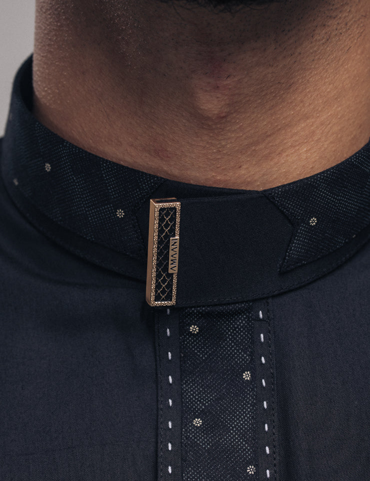 Amaani Onyx Thobe in black, signature button detailing on collar and placket