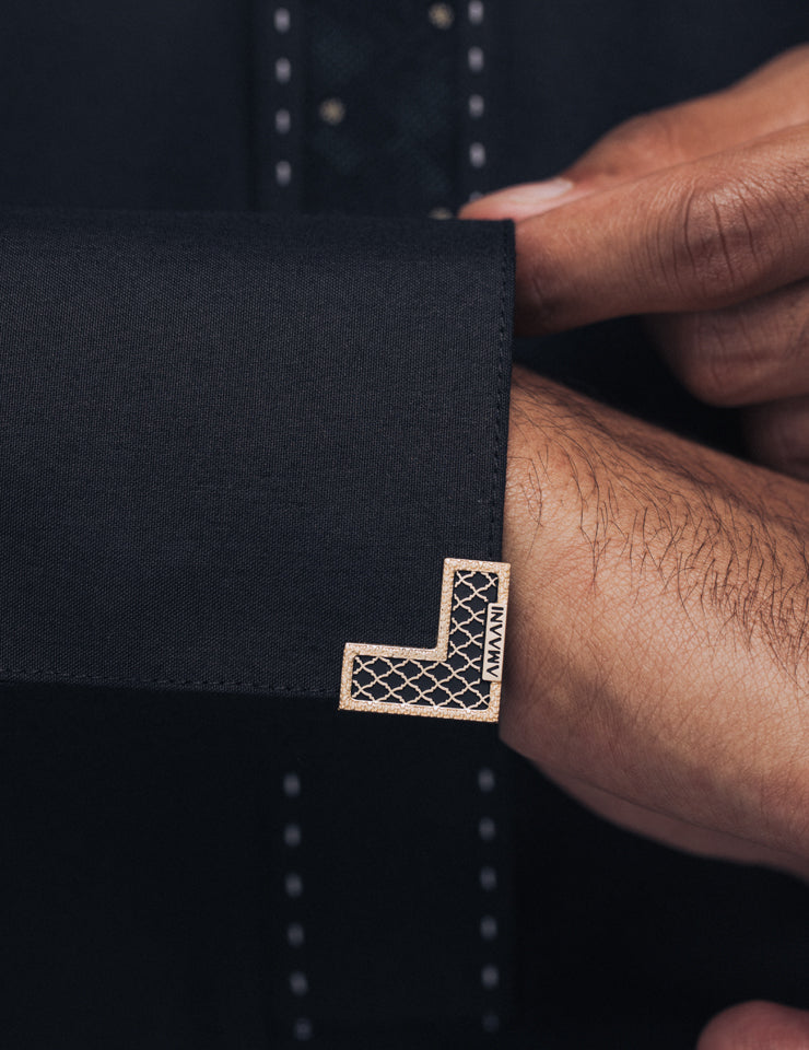 Amaani Onyx Thobe in black, cuff detail with Amaani Signature Button