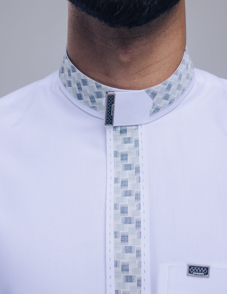 Amaani Onyx Thobe in classic white, signature button detail on collar and placket