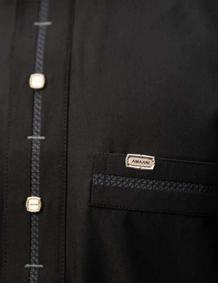 Amaani Eclipse thobe with signature Amaani buttons on the top pocket and placket, in jet black