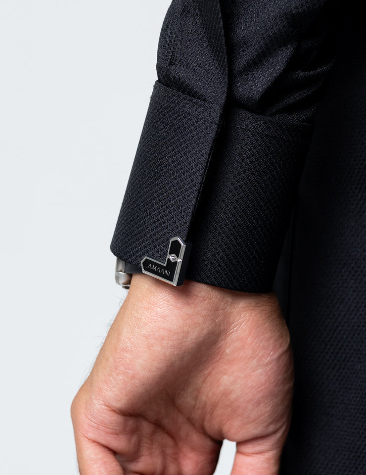 Placket detail with signature Amaani buttons on the black Asrar Saudi Thobe