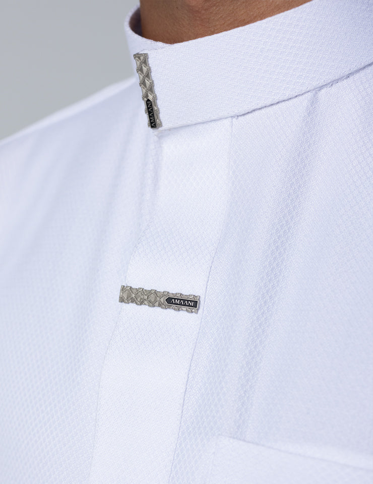 Textured weave fabric detail on the white Amaani Nibras Saudi Thobe
