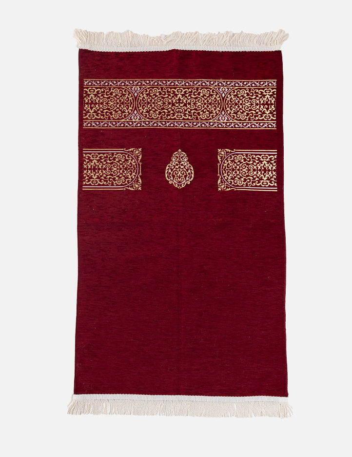 Kiswah Musallah in maroon, a warm rich prayer mat carrying the Kaabah-inspired geometric design